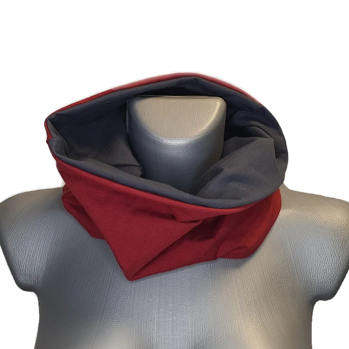 Red and gray neck warmer on a mannequin with a white background
