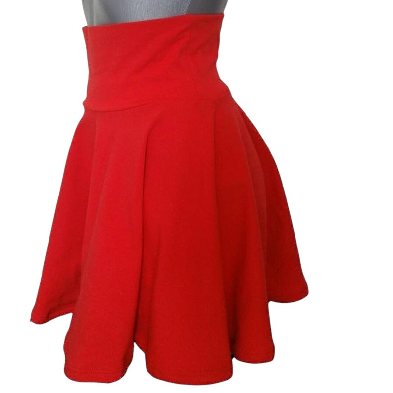 Fly and Fit red cotton skater skirt with a high-waisted, elastic-free design for a comfortable, fluid silhouette.