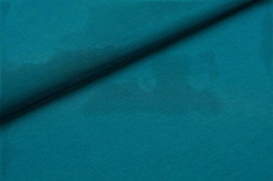 Fly and Fit teal cotton fabric texture for Free-Flow contrast shorts, showing soft breathable material detail.