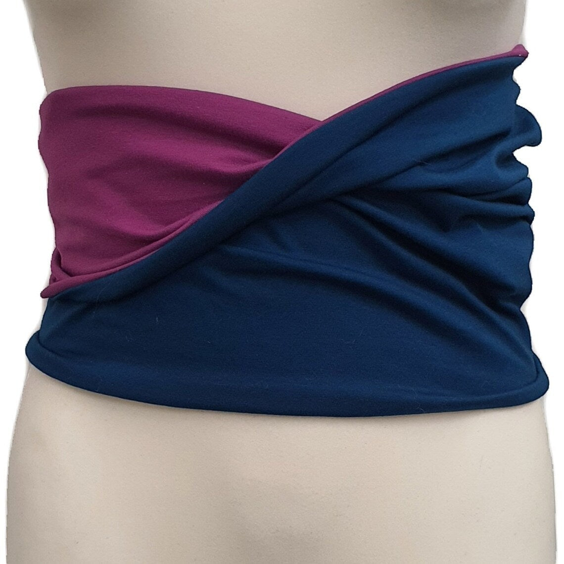 Fly and Fit reversible petrol and lilac haramaki core warmer worn on a mannequin for aerial and fitness training.
