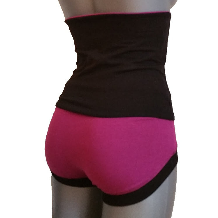 Black and pink athletic outfit on a mannequin against a white background