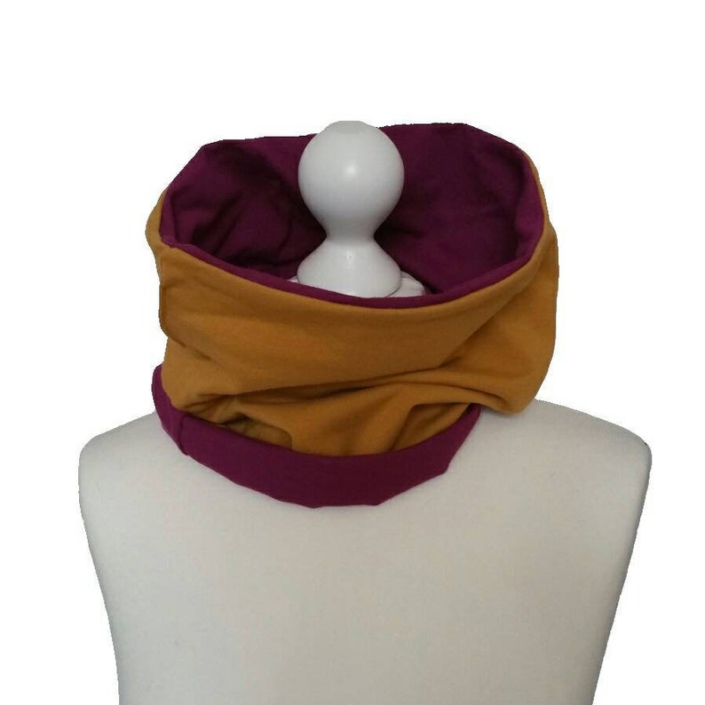 Two-toned scarf on a mannequin with a white background