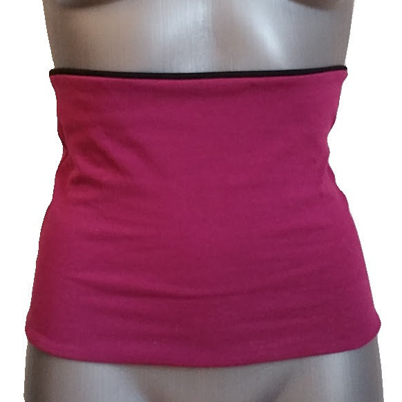 Pink back warmer top on a mannequin with a white background