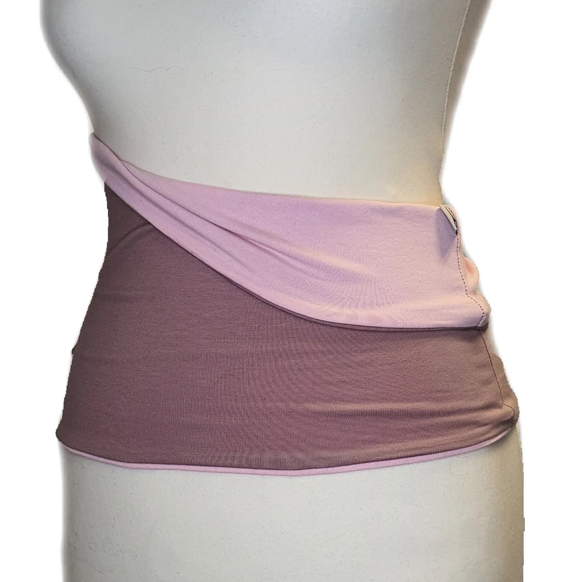 Mannequin wearing a two-tone skirt with pink top and purple bottom on a white background
