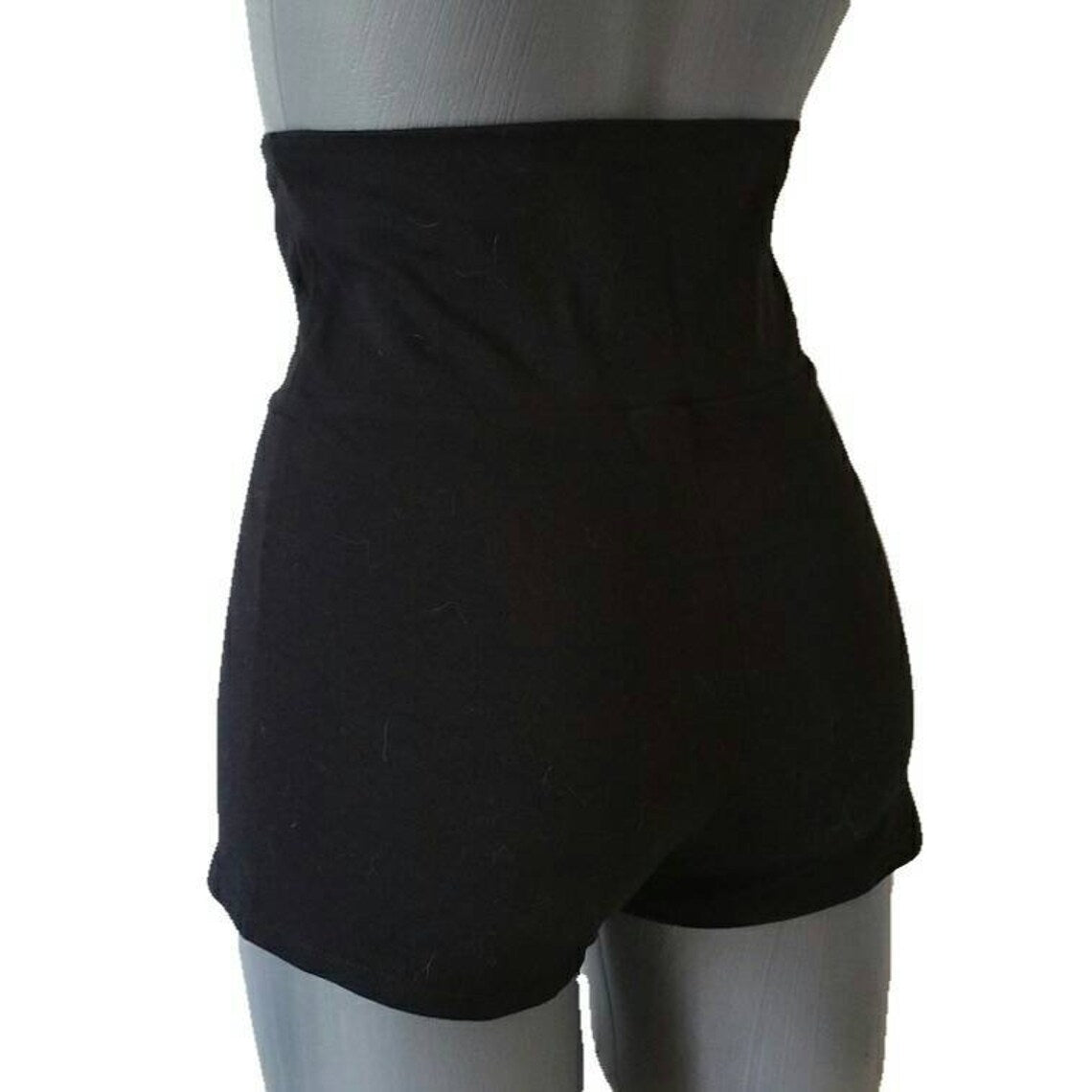 Back view of dance shorts on a mannequin against white background
