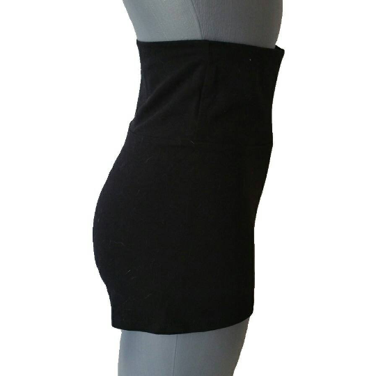 Side view of a black shorts on a puppet against white background