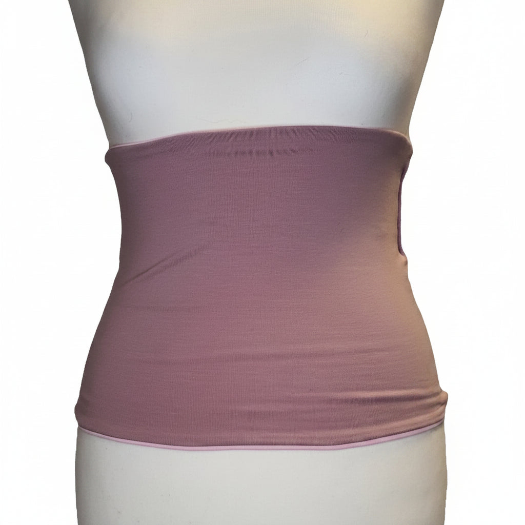 Mannequin wearing a mauve waist trainer on a white background