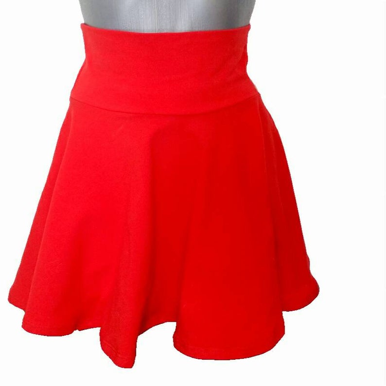 Red skirt on a mannequin against a white background
