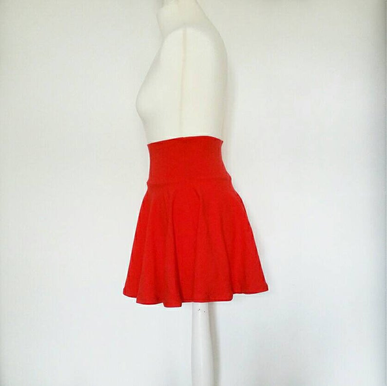 Red skirt on a mannequin against a white background