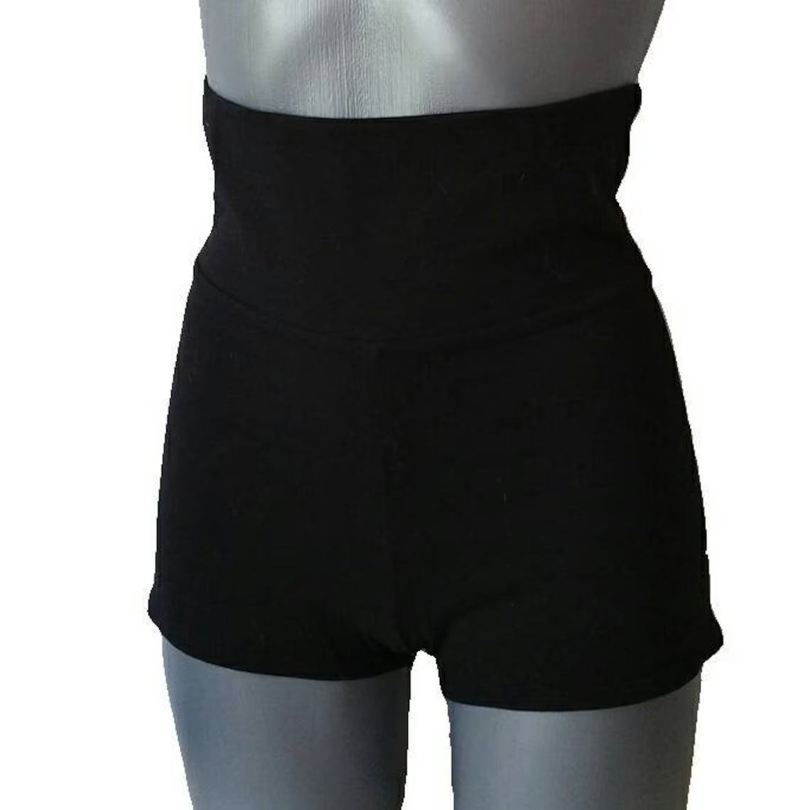 Black shorts on a mannequin against a white background