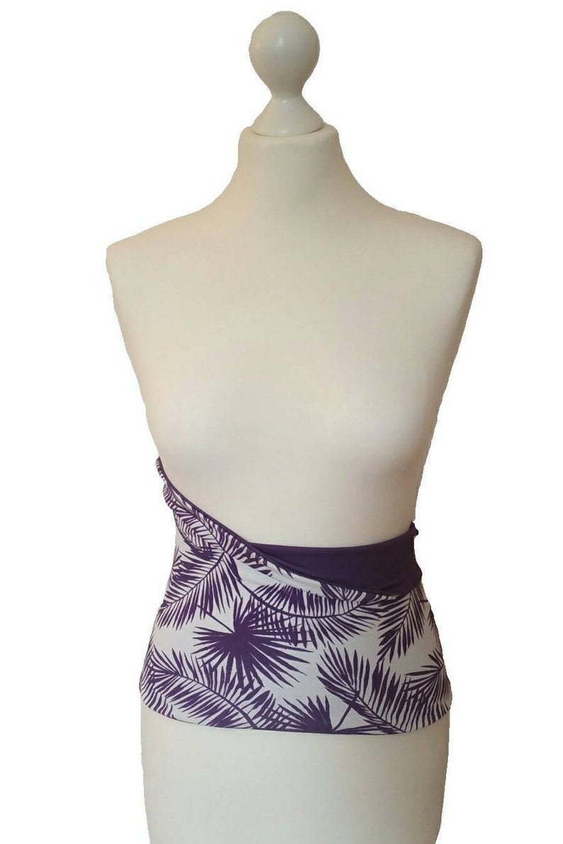 Purple and white patterned skirt on a mannequin against a white background