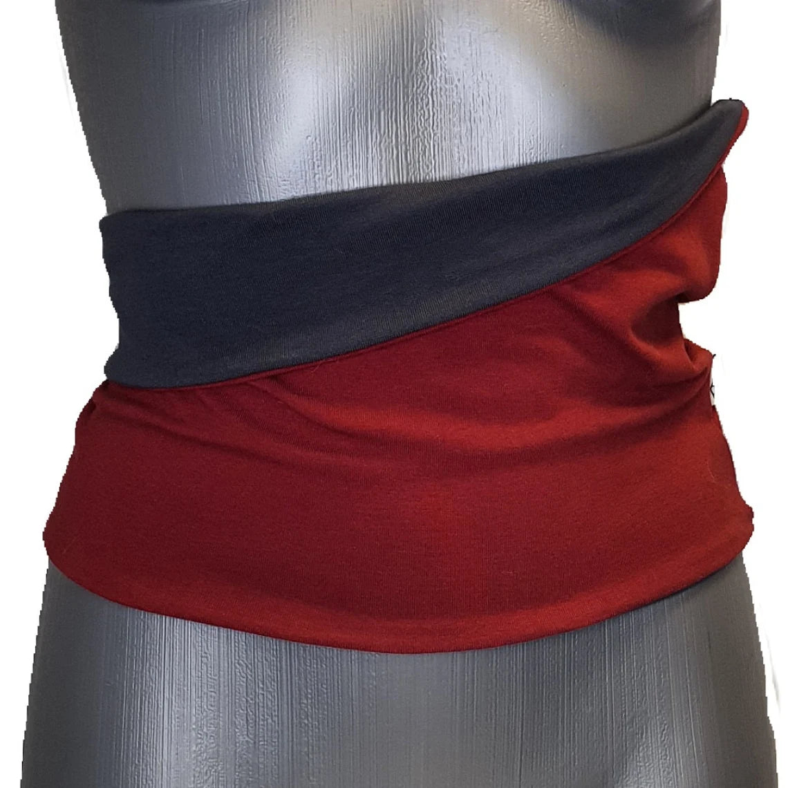 Red and black fabric wrap on a mannequin with a white background