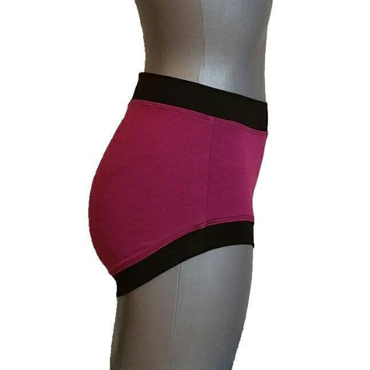 Violet high-waisted underwear with black waistband on a mannequin against a white background