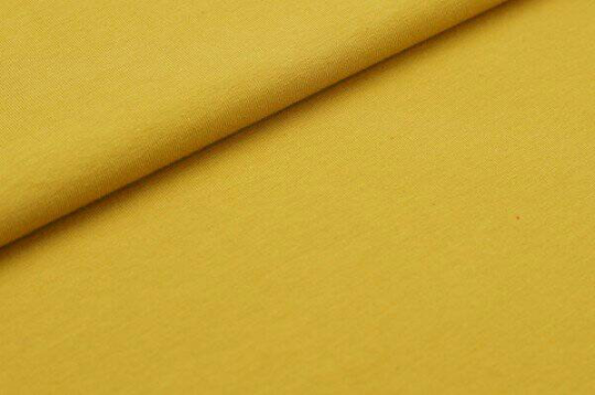 Close-up of yellow fabric with a slight texture
