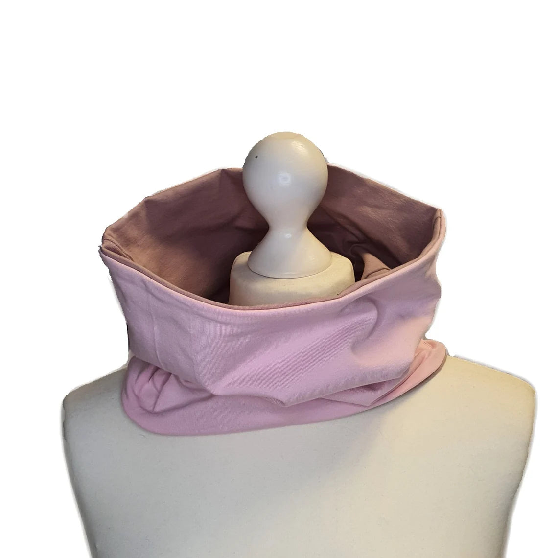 Pink neck gaiter on a mannequin with a white background