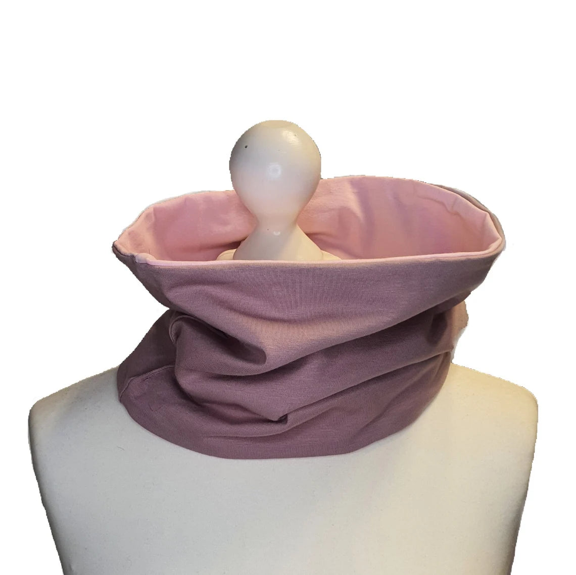 Pink neck gaiter on a mannequin head against a white background