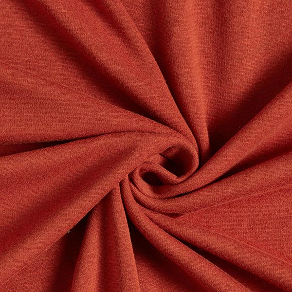 Fly and Fit Alpine fleece core warmer fabric in a vibrant red sunset tone with a soft, plush texture.
