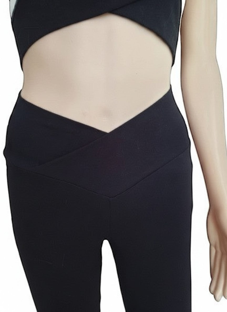Fly and Fit black cotton leggings featuring a flattering V-shape high-rise waistband for yoga and active movement.