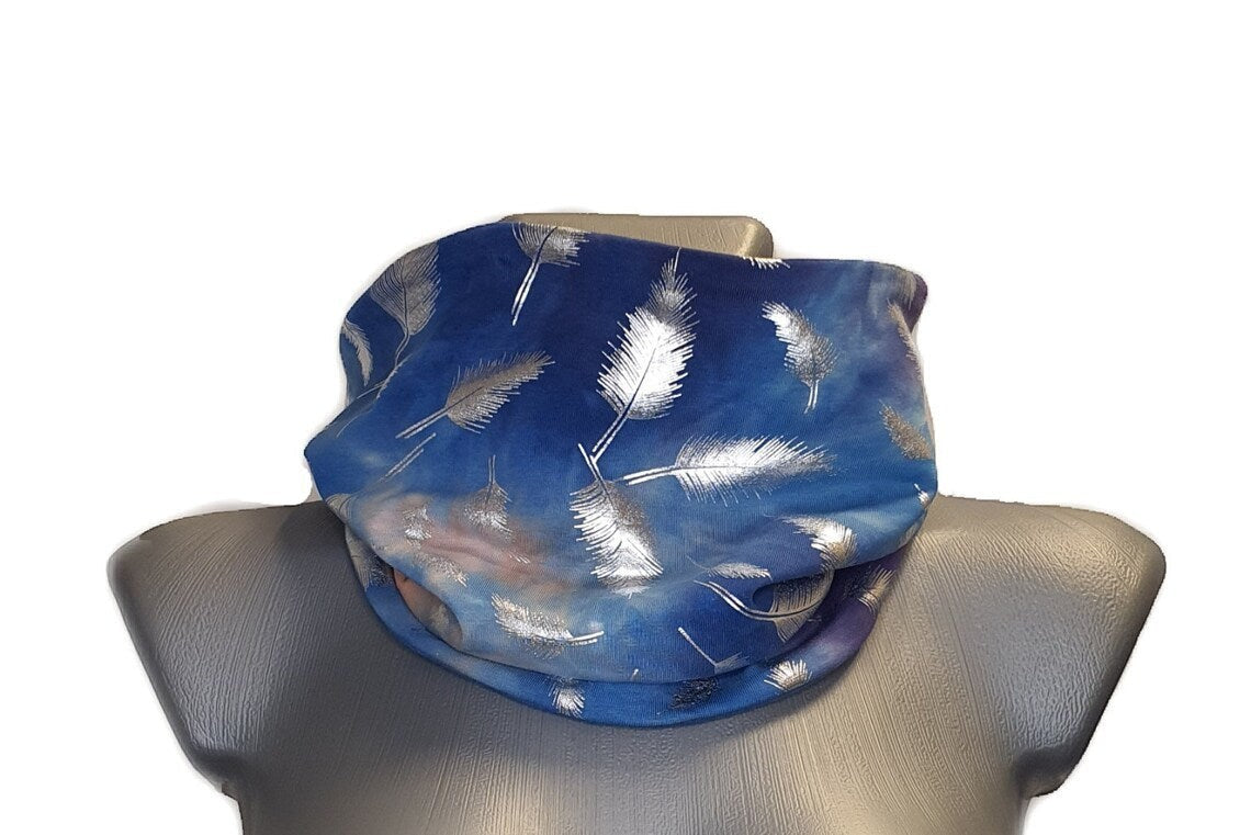 Fly and Fit reversible cotton jersey back warmer in blue tie-dye with a silver feather print on a mannequin