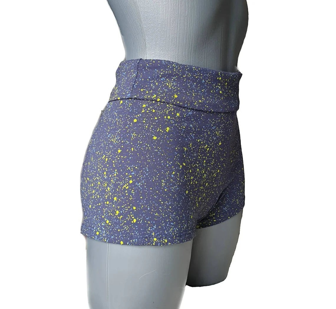 Fly and Fit blue cotton shorts with neon yellow and light blue paint splatter, high-waist to low-rise adjustable fit.