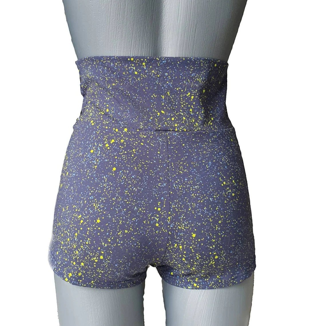 Fly and Fit blue cotton shorts with neon yellow and light blue paint splatter, high-waisted design, suitable for aerial fitness.