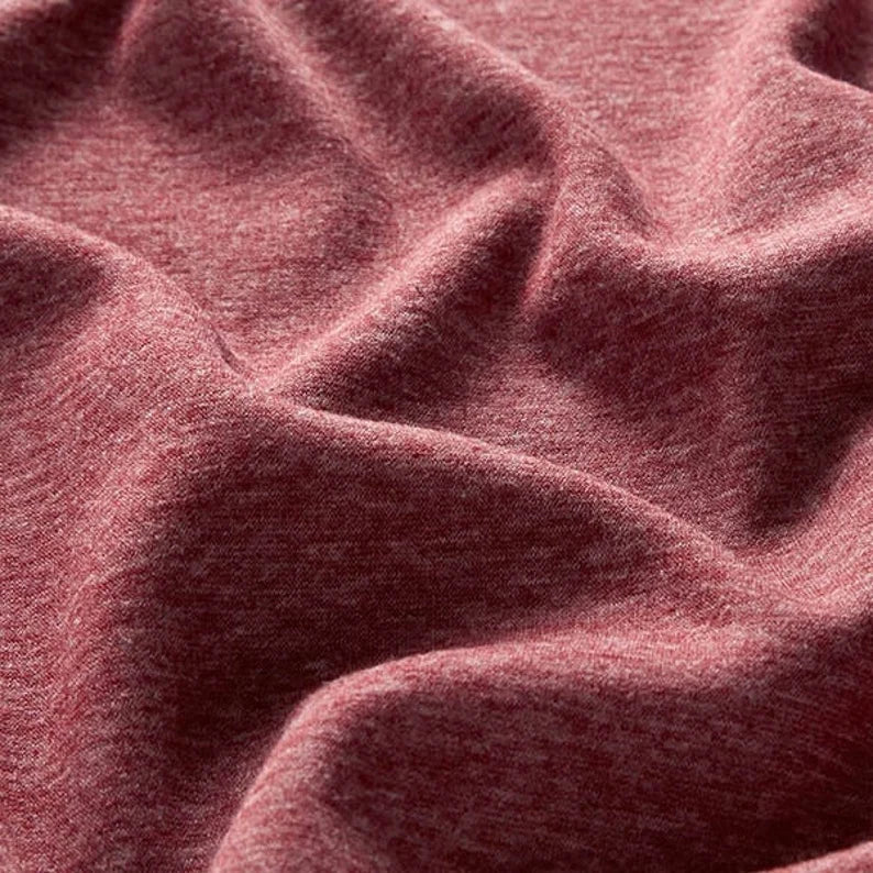 Fly and Fit burgundy red Alpine fleece core warmer fabric texture showing soft thermal material detail