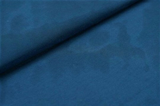 Fly and Fit buttery soft dark blue cotton fabric swatch with a diagonal fold, showing high-quality textile texture.