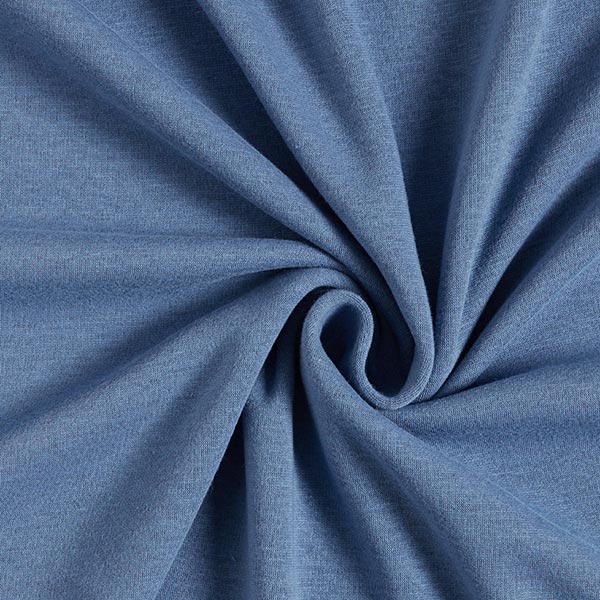 Fly and Fit Alpine fleece core warmer in denim blue, showing the soft, thermal fabric texture and deep blue tone.