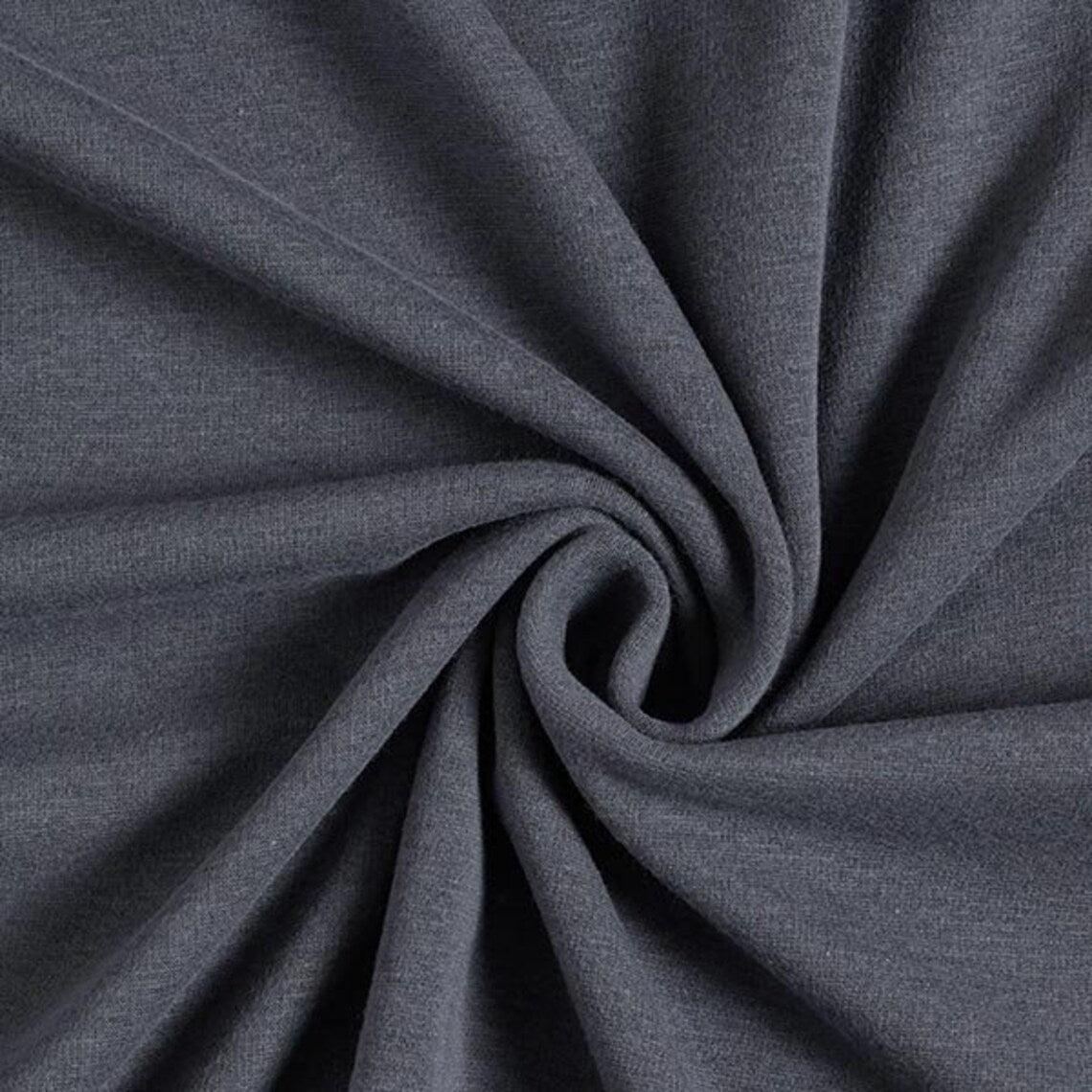Fly and Fit Alpine Fleece Core Warmer in gray, showing the soft, high-performance thermal fabric texture.
