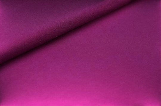 Fly and Fit Free-Flow shorts fabric in a vibrant magenta purple cotton, showing the soft, smooth texture.