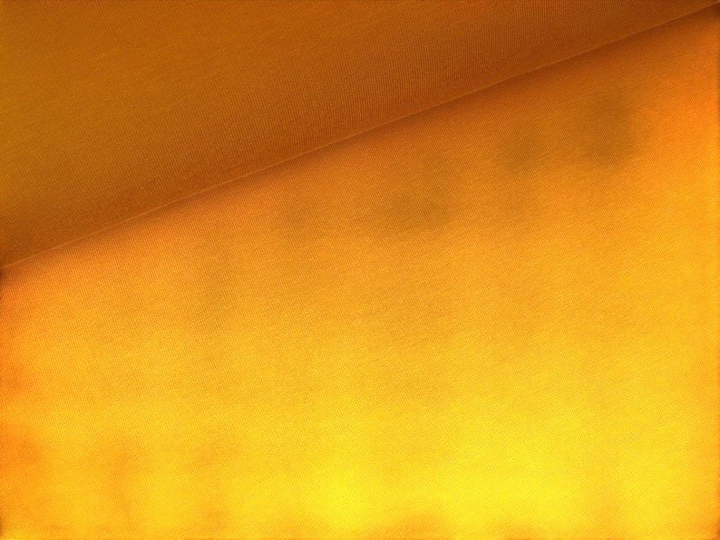 Fly and Fit bespoke double-layered cotton sweat haramaki core warmer in a vibrant mustard yellow fabric texture.