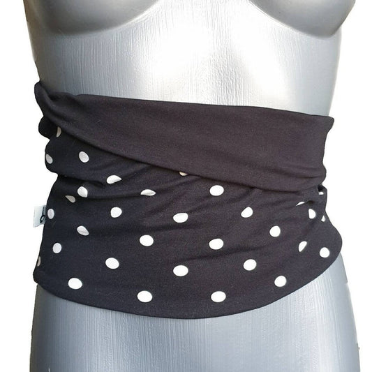 Fly and Fit reversible black and white polka dot core warmer on a mannequin for lower back support and training.