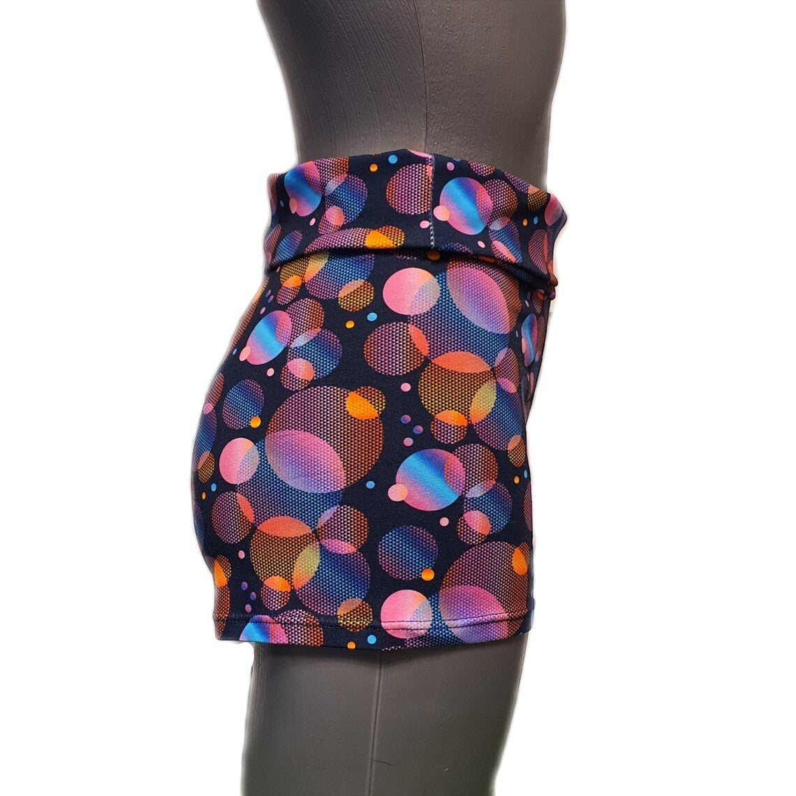 Fly and Fit psychedelic bubble print cotton shorts with a high-waist wrap design on a mannequin, side view.