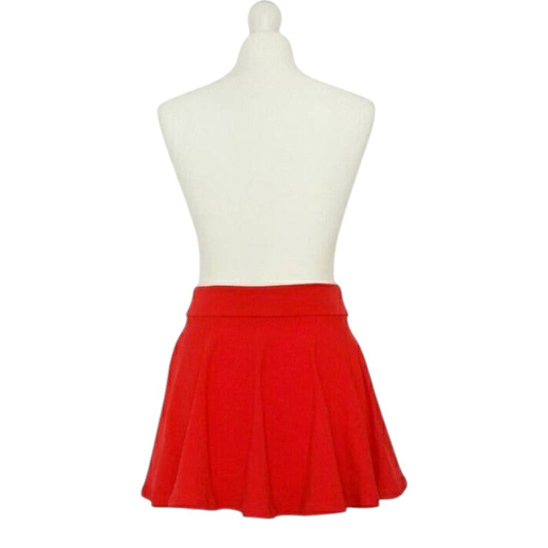Fly and Fit red cotton skater skirt with a wide, elastic-free waistband on a white mannequin display.