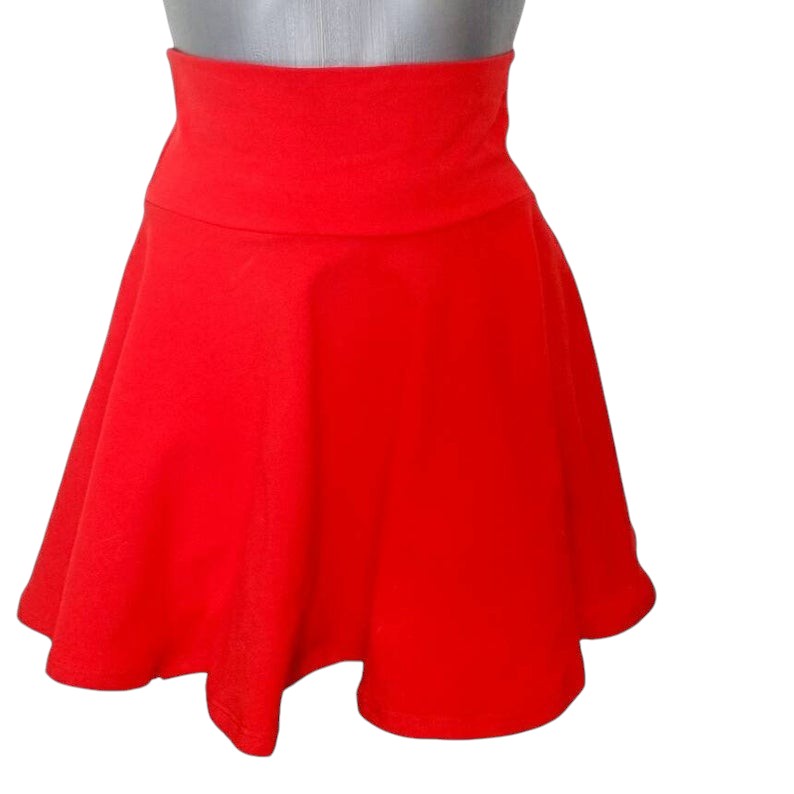 Fly and Fit red cotton skater skirt with a wide, elastic-free zero-pressure waistband for a comfortable fit.