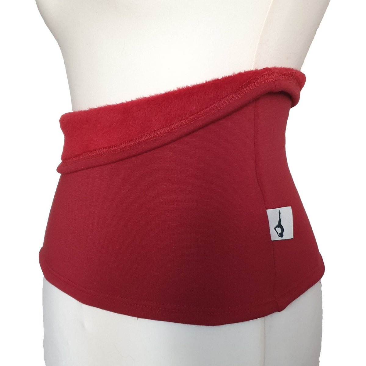 Fly and Fit red Alpine fleece core warmer worn on a mannequin, showing the plush interior and sleek exterior.