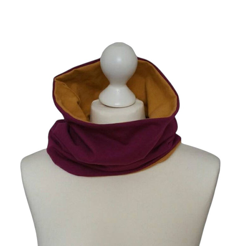 Fly and Fit reversible bordeaux and mustard cotton jersey core warmer on a mannequin for back support.