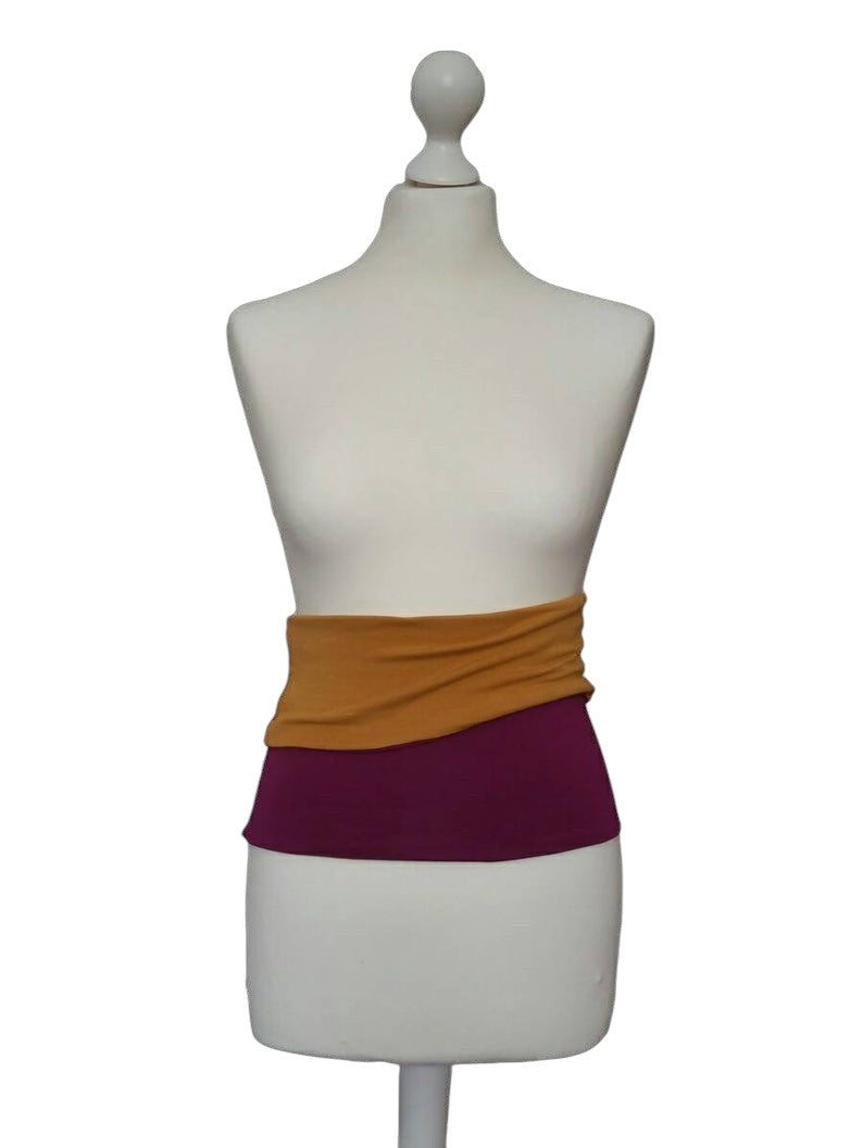 Fly and Fit reversible bordeaux and mustard cotton jersey core warmer on a mannequin for back support.
