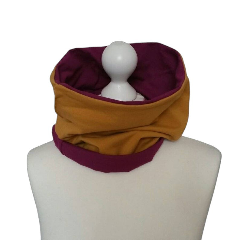 Fly and Fit reversible bordeaux and mustard cotton jersey core warmer on a mannequin for aerial and fitness training.