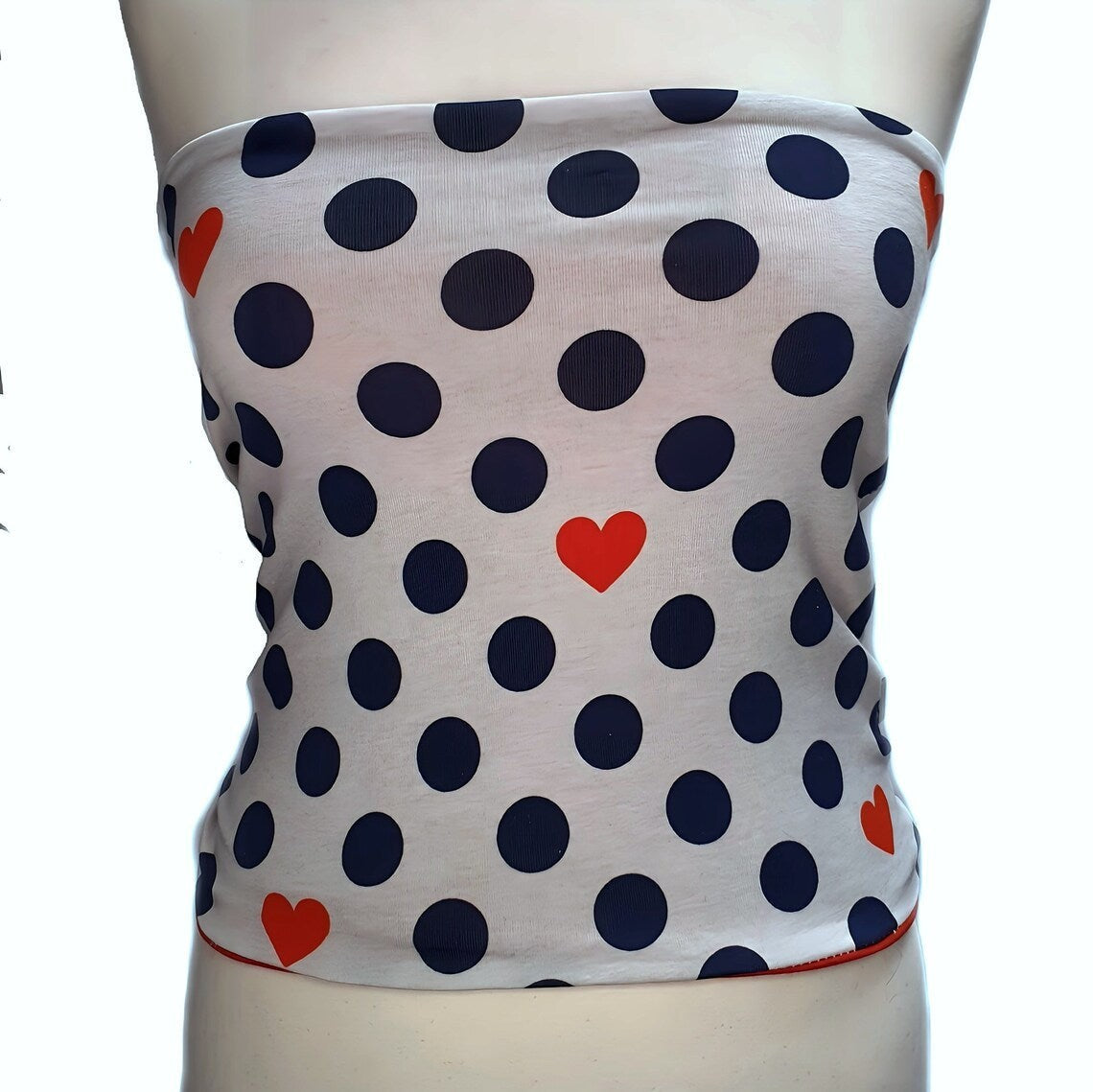 Fly and Fit reversible cotton jersey back warmer featuring a white print with navy polka dots and red hearts