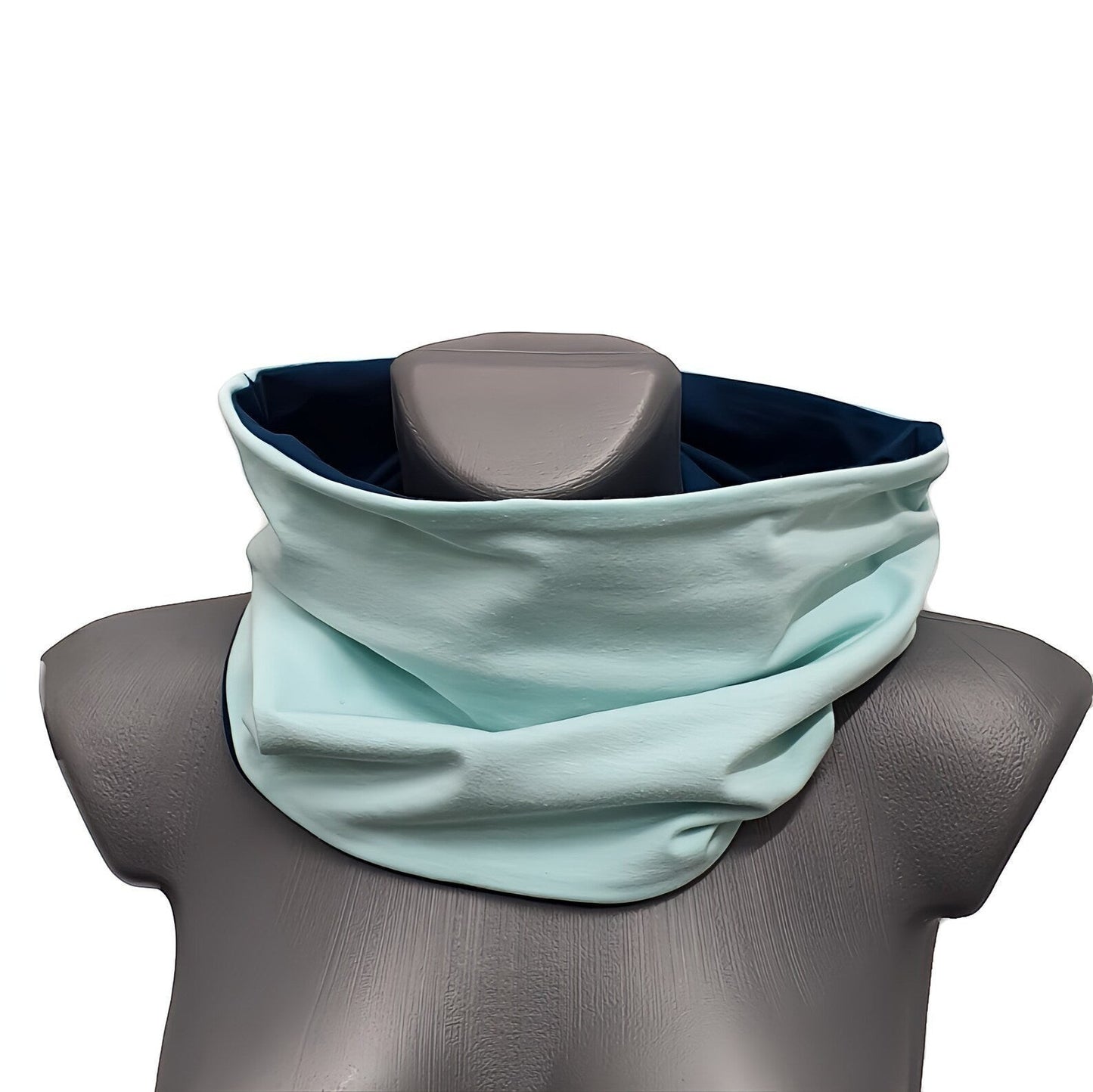 Fly and Fit reversible haramaki core warmer in mint and deep petrol blue cotton jersey on a mannequin torso.