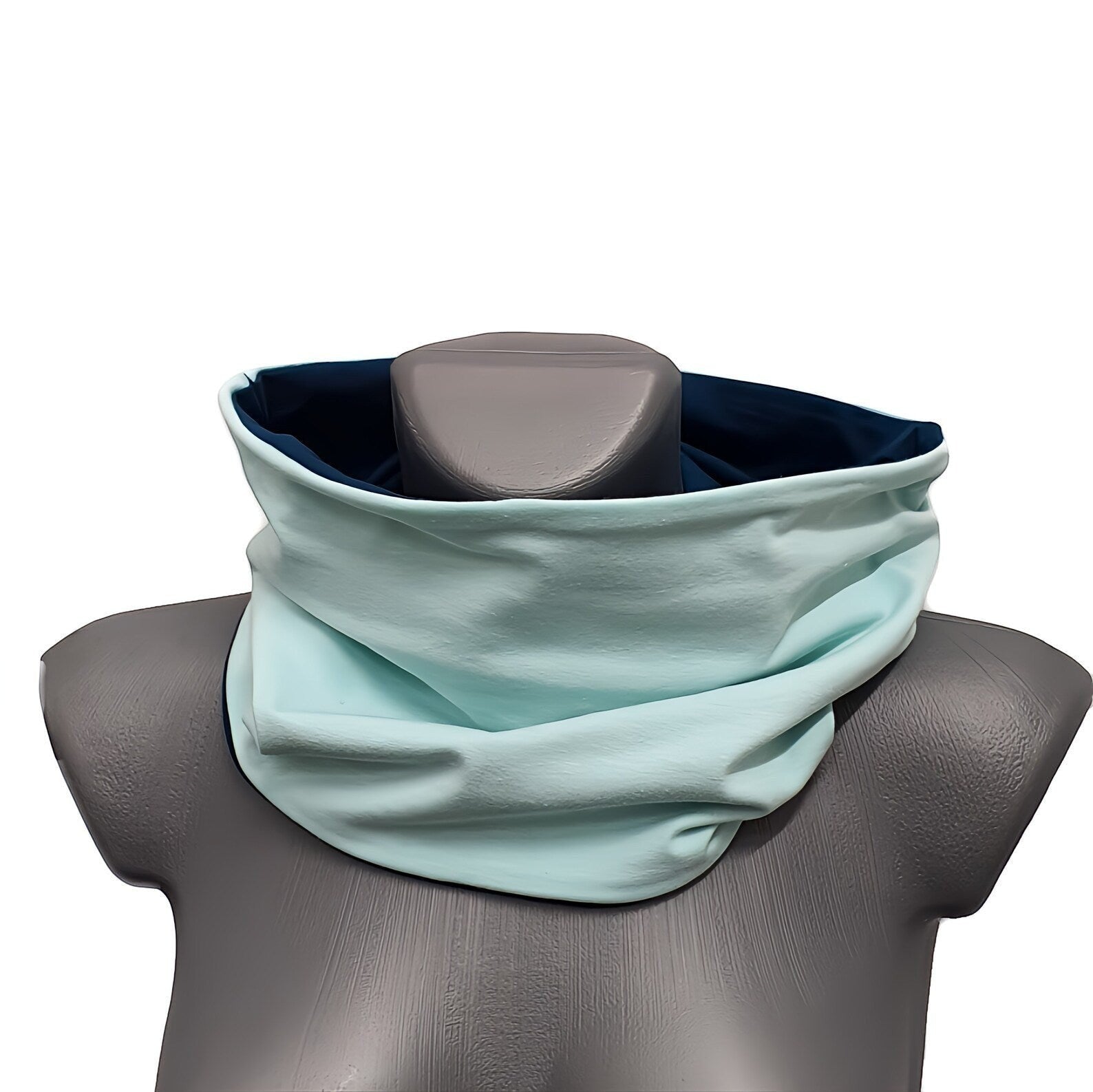 Fly and Fit reversible haramaki core warmer in mint and deep petrol blue cotton jersey on a mannequin torso.