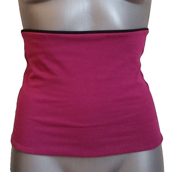 Fly and Fit reversible haramaki core warmer in magenta pink, worn on a mannequin for ballet and fitness support.