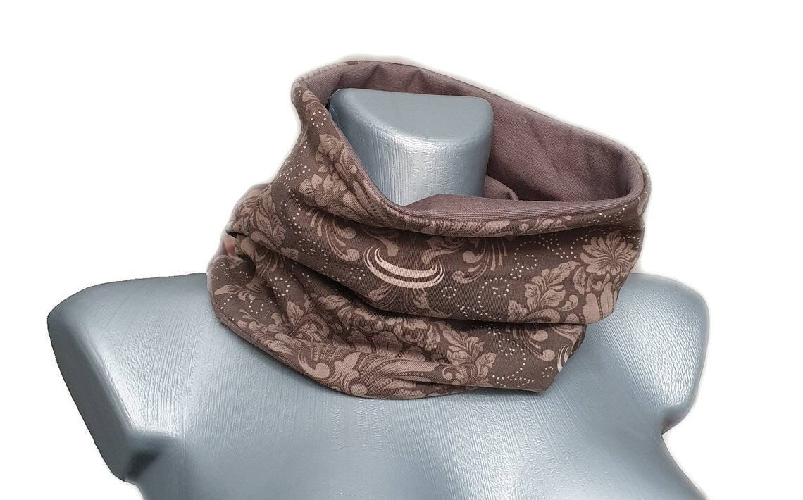 Fly and Fit reversible mocha brown cotton jersey haramaki back warmer with elegant ornament print on a mannequin