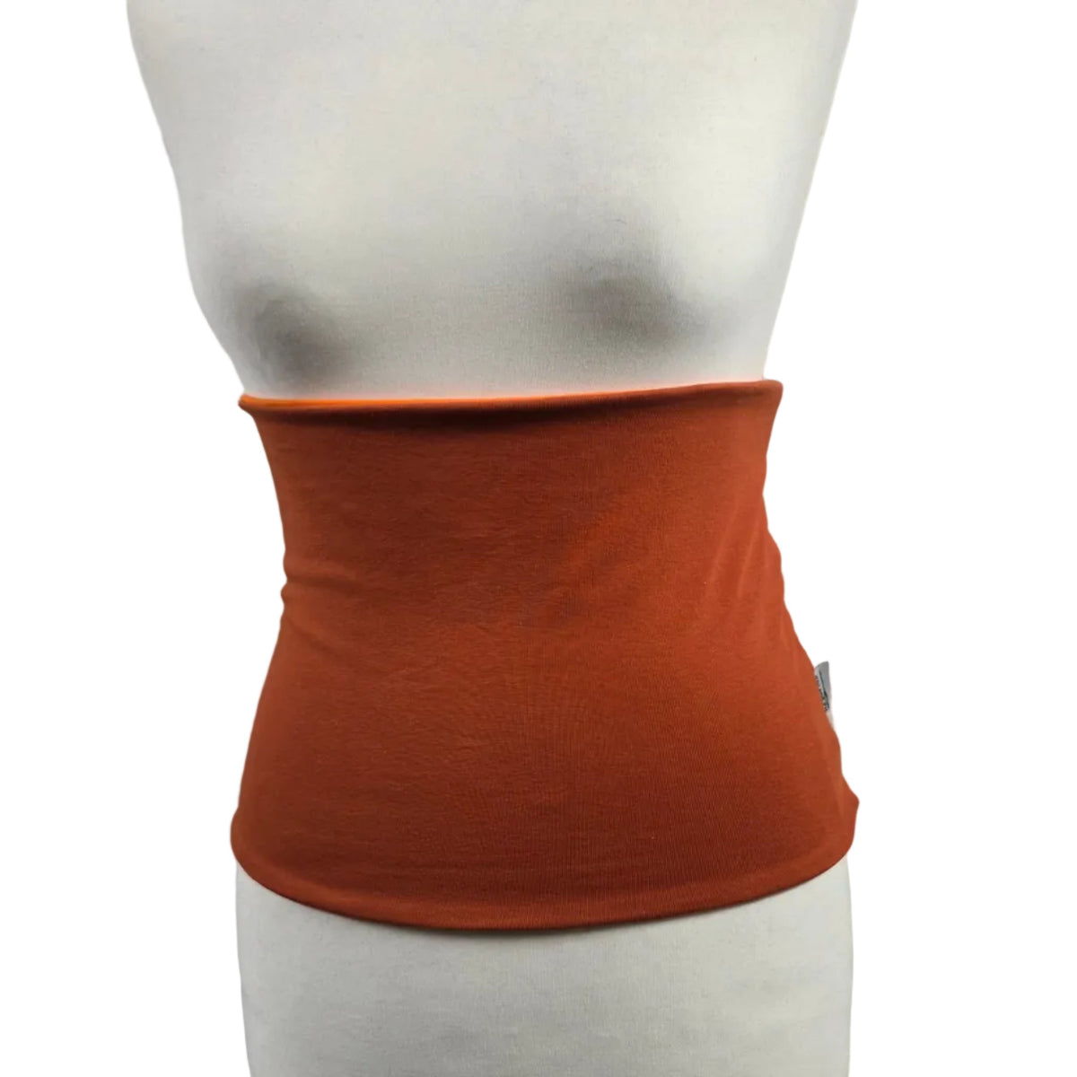 Fly and Fit reversible cotton jersey haramaki core warmer in muted rust orange on a mannequin