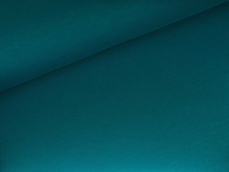Fly and Fit teal cotton sweat haramaki wrap for core warmth and recovery. Single layer, lightweight, and stretchy.